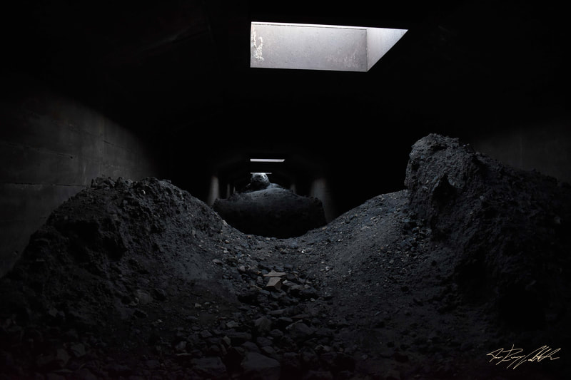 Photograph of abandoned mining tunnel.